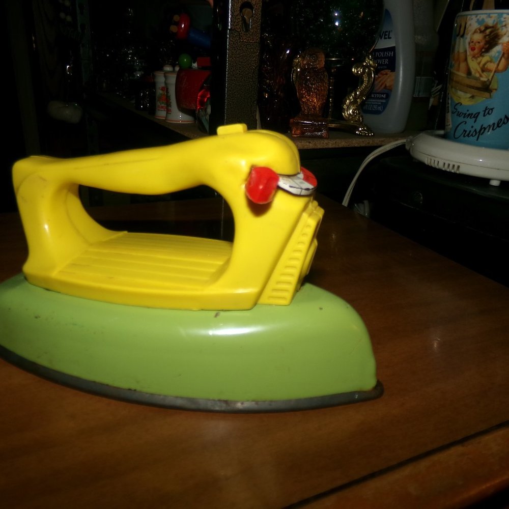 very vintage hard plastic & metal toy iron.